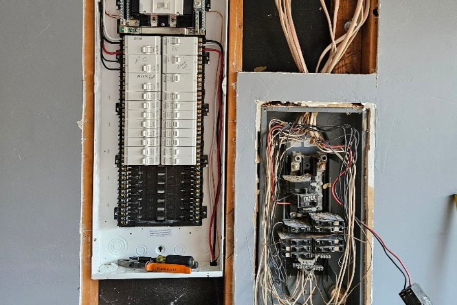 Wired electrical terminals on metal bar wiring cable box, residential house under construction